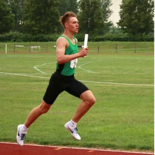 Jonty competing in athletics after his knees healed without surgery