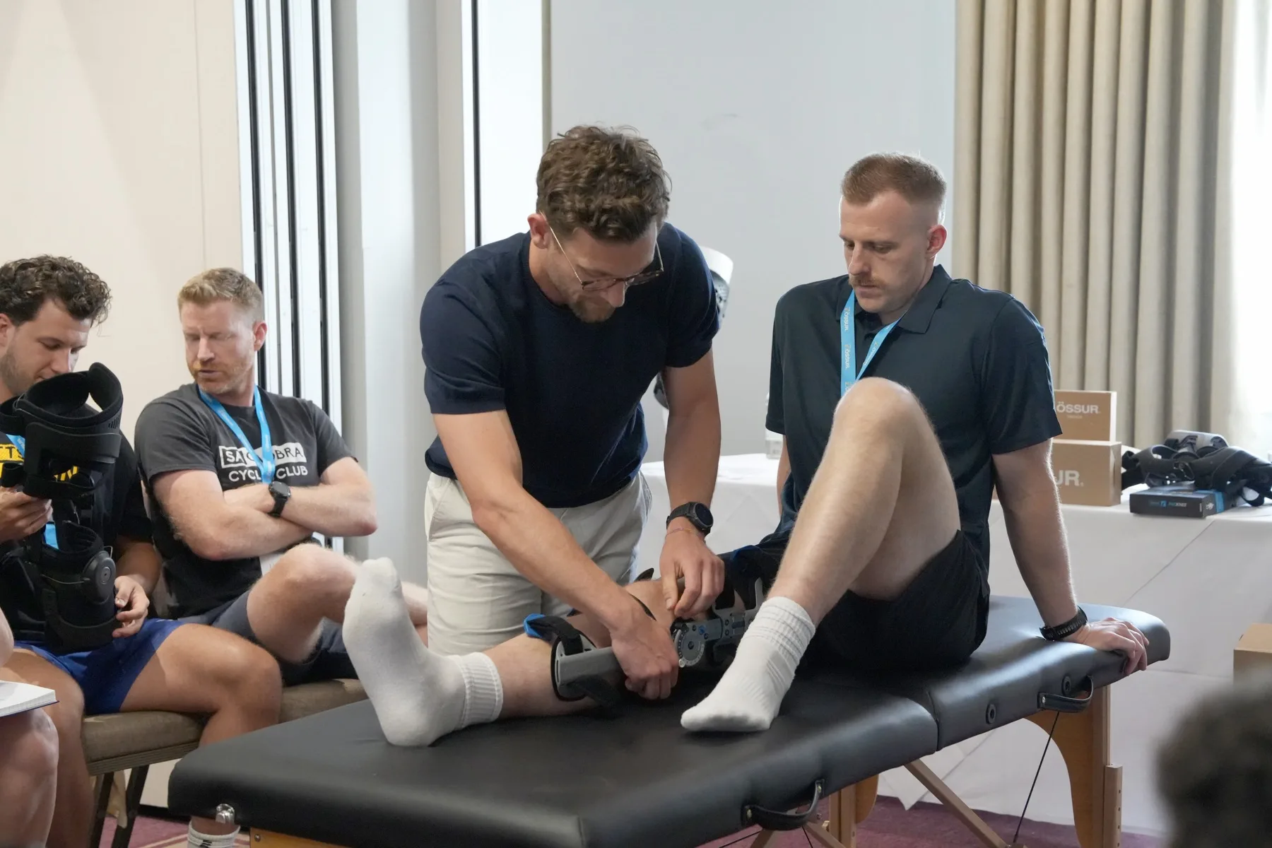 A knee brace being fitted as part of joint-preserving treatment