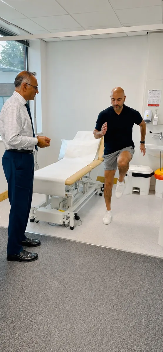 Mr Trikha reviewing a patient's knee